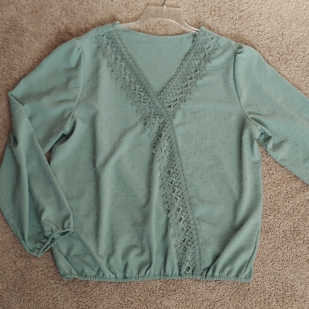 New. Elegant blouse. Size 2XL